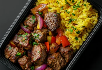 Garlic Butter Steak Bites with Roasted Vegetables and Saffron Rice